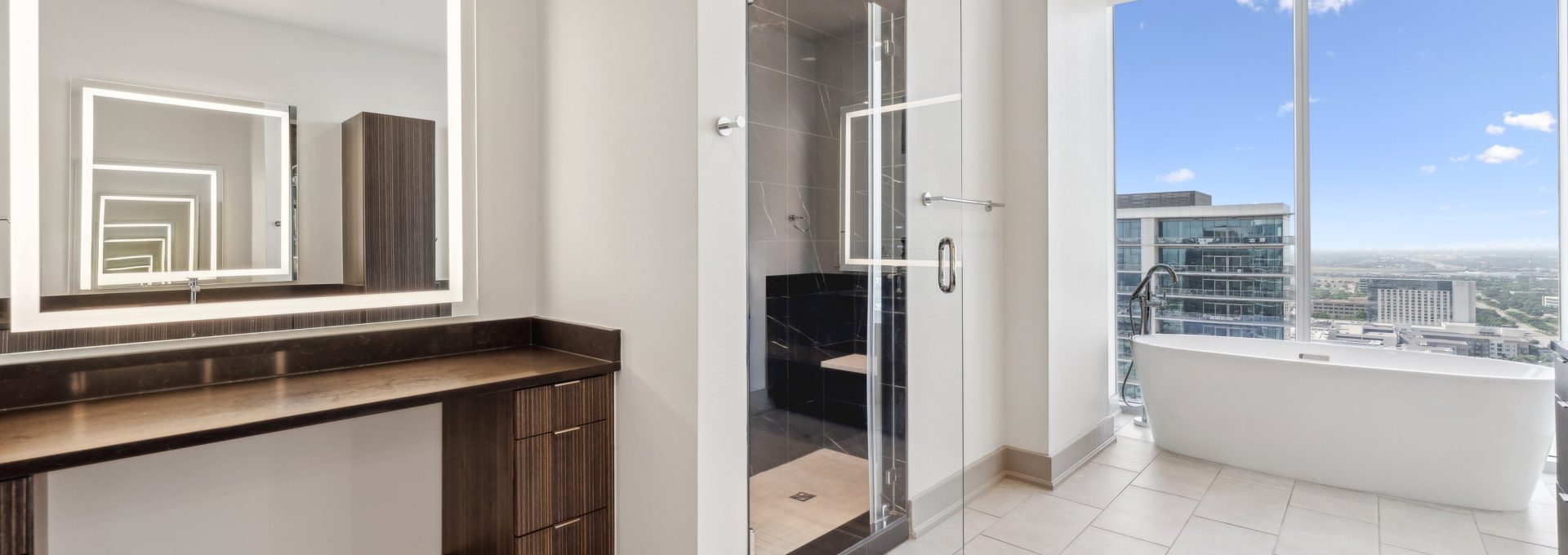 a bathroom with a large window and a large mirror at The LVL 29